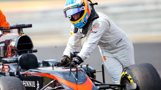 BUDAPEST, HUNGARY - JULY 25:  Fernando Alonso of McLaren and Spain breaks down during Qualifying for the Formula One Grand Prix of Hungary at Hungaroring on July 25, 2015 in Budapest, Hungary.  (Photo by Peter Fox/Getty Images)