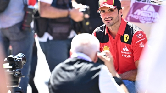 Ferrari's Spanish driver Carlos Sainz Jr. poses for a photographer at the Red Bull race track in Spielberg, Austria on June 29, 2023, ahead of the Austrian Formula One Grand Prix. (Photo by Joe Klamar / AFP)