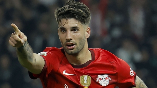 (FILES) Leipzig's Hungarian midfielder Dominik Szoboszlai celebrates after scoring the 2-0 goal during the German Cup (DFB Pokal) final football match RB Leipzig v Eintracht Frankfurt in Berlin, Germany, on June 3, 2023. Liverpool confirmed the signing of Dominik Szoboszlai from RB Leipzig on Sunday, July 2, after paying the Hungarian's 70-million-euro (£60 million, $76 million) release clause. (Photo by Odd ANDERSEN / AFP) / DFB REGULATIONS PROHIBIT ANY USE OF PHOTOGRAPHS AS IMAGE SEQUENCES AND QUASI-VIDEO.