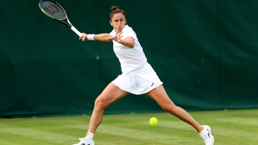 LONDON, ENGLAND - JULY 03: Sara Sorribes Tormo of Spain  plays a forehand against Martina Trevisan of Italy in the Women's Singles first round match on day one of The Championships Wimbledon 2023 at All England Lawn Tennis and Croquet Club on July 03, 2023 in London, England. (Photo by Clive Brunskill/Getty Images)