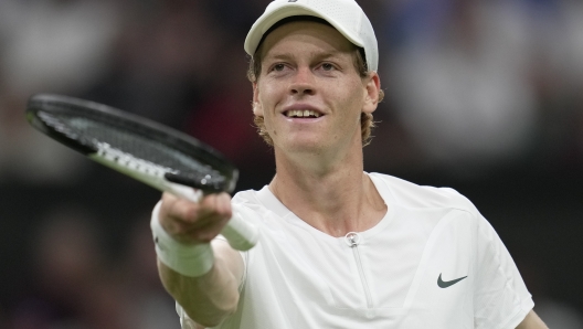 Italy's Jannik Sinner celebrates winning a point against Argentina's Juan Manuel Cerundolo in a first round men's singles match on day one of the Wimbledon tennis championships in London, Monday, July 3, 2023. (AP Photo/Kin Cheung)