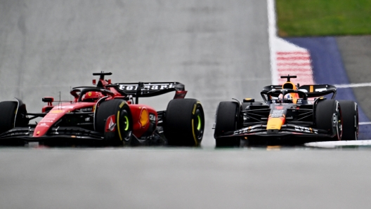 Red Bull Racing's Dutch driver Max Verstappen (R) competes with Ferrari's Monegasque driver Charles Leclerc during the Formula One Austrian Grand Prix at the Red Bull race track in Spielberg, Austria on July 2, 2023. (Photo by Joe Klamar / AFP)