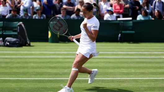 LONDON, ENGLAND - JULY 05: Elisabetta Cocciaretto of Italy celebrates against Camila Osorio of Colombia in the Women's Singles first round match during day three of The Championships Wimbledon 2023 at All England Lawn Tennis and Croquet Club on July 05, 2023 in London, England. (Photo by Patrick Smith/Getty Images)