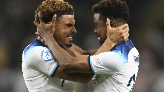 England's Morgan Gibbs-White, left, and Angel Gomes celebrate their 1-0 victory in the Euro 2023 U21 Championship final soccer match between England and Spain at the Batumi Arena stadium in Batumi, Georgia, Saturday, July 8, 2023. (AP Photo/Tamuna Kulumbegashvili)