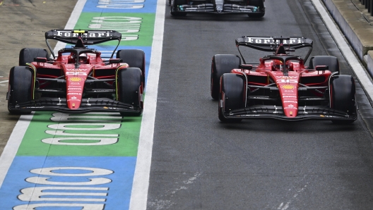 Ferrari driver Charles Leclerc of Monaco, right and Ferrari driver Carlos Sainz of Spain steer their cars before the qualifying session at the British Formula One Grand Prix at the Silverstone racetrack, Silverstone, England, Saturday, July 8, 2023. The British Formula One Grand Prix will be held on Sunday. (Christian Bruna/Pool photo via AP)