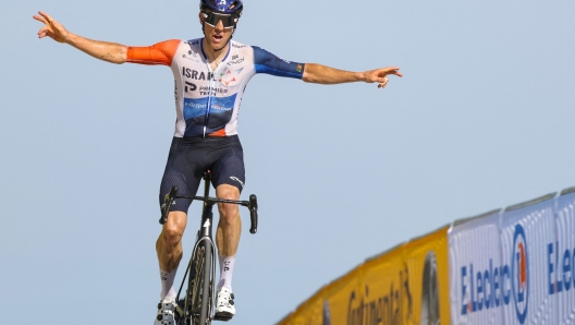 TOPSHOT - Israel - Premier Tech's Canadian rider Michael Woods cycles to the finish line to win the 9th stage of the 110th edition of the Tour de France cycling race, 182,5 km between Saint-Leonard-de-Noblat and Puy de Dome, in the Massif Central volcanic mountains in central France, on July 9, 2023. (Photo by Thomas SAMSON / AFP)