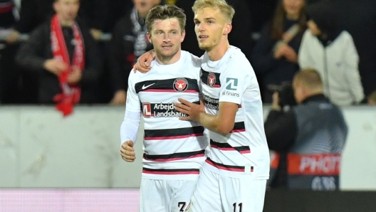 FC Midtjylland's Anders Drejer, left, celebrates scoring with teammate Gustav Isaksen during the Europa League Group F soccer match between FC Midtjylland and SK Sturm Graz in MCH Arena in Herning, Denmark, Thursday Nov. 3 2022. (Ernst van Norde/Ritzau Scanpix via AP)