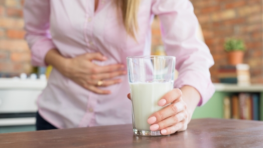 Woman feeling sick by drinking milk