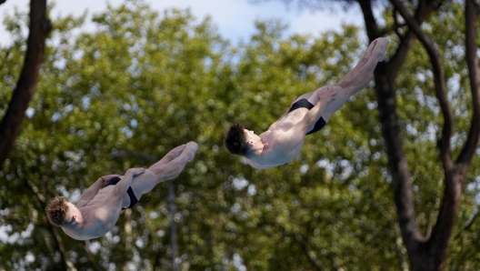 Anthony Harding and Jack Laugher of Britain dive during synchronised Men's 3m springboard competition, at the European aquatics, in Rome, Sunday Aug. 21, 2022. (AP Photo/Domenico Stinellis)