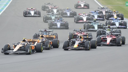 McLaren driver Lando Norris of Britain, left, leads during the British Formula One Grand Prix race at the Silverstone racetrack, Silverstone, England, Sunday, July 9, 2023. (AP Photo/Luca Bruno)