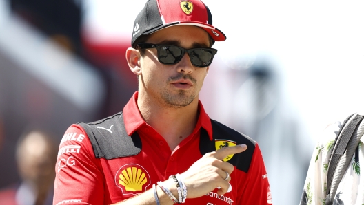 BUDAPEST, HUNGARY - JULY 20: Charles Leclerc of Monaco and Ferrari walks in the Paddock during previews ahead of the F1 Grand Prix of Hungary at Hungaroring on July 20, 2023 in Budapest, Hungary. (Photo by Francois Nel/Getty Images)