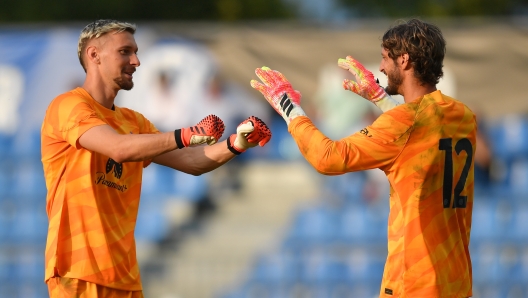 COMO, ITALY - JULY 21: (L-R) Andrei Ionut Radu of FC Internazionale embraces Raffaele Di Gennaro of FC Internazionale  during the friendly match between FC Internazionale and US Pergolettese at the club's training ground Suning Training Center at Appiano Gentile on July 21, 2023 in Como, Italy. (Photo by Mattia Pistoia - Inter/Inter via Getty Images)