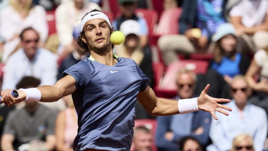 Italy's Lorenzo Musetti returns the ball to Norway's Casper Ruud during their semi final tennis match at the Swedish Open ATP tennis tournament in Bastad, Sweden, Saturday, July 22, 2023. (Anders Bjuro/TT News Agency via AP)