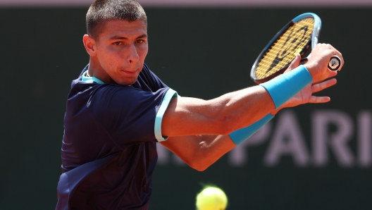 PARIS, FRANCE - MAY 29: Alexei Popyrin of Australia plays a backhand against Aslan Karatsev during their Men's Singles First Round Match on Day Two of the 2023 French Open at Roland Garros on May 29, 2023 in Paris, France. (Photo by Julian Finney/Getty Images)