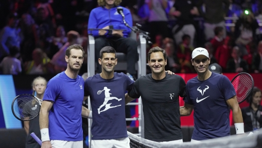 FILE - From left, Britain's Andy Murray, Serbia's Novak Djokovic, Switzerland's Roger Federer and Spain's Rafael Nadal attend a training session ahead of the Laver Cup tennis tournament at O2 in London, Thursday, Sept. 22, 2022. Who was the last player other than Roger Federer, Novak Djokovic, Rafael Nadal or Andy Murray to win the men's singles championship at Wimbledon? (AP Photo/Kin Cheung, File)