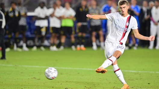 AC Milan's Belgian midfielder Charles De Ketelaere takes a penalty shot during the end of regulation shootout at a pre-season friendly football match between Juventus FC and AC Milan at Dignity Health Sports Park in Carson, California, on July 27, 2023. (Photo by Frederic J. BROWN / AFP)