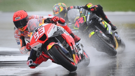 NORTHAMPTON, ENGLAND - AUGUST 05: Marc Marquez of Spain (left) and Marco Bezzecchi of Italy in action during the MotoGP of Great Britain - Second Free Practice at Silverstone Circuit on August 05, 2023 in Northampton, England. (Photo by Clive Mason/Getty Images)