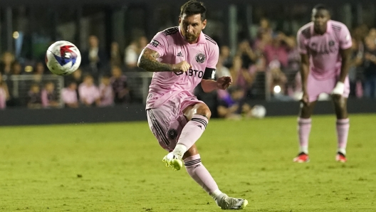 Inter Miami forward Lionel Messi (10) kicks the ball on a free kick during the first half of a Leagues Cup soccer match against Orlando City, Wednesday, Aug. 2, 2023, in Fort Lauderdale, Fla. (AP Photo/Lynne Sladky)