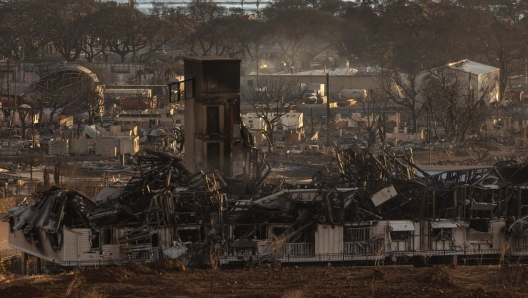 TOPSHOT - Burned houses and buildings are pictured in the aftermath of a wildfire, is seen in Lahaina, western Maui, Hawaii on August 12, 2023. Hawaii's Attorney General, Anne Lopez, said August 11, she was opening a probe into the handling of devastating wildfires that killed at least 80 people in the state this week, as criticism grows of the official response. The announcement and increased death toll came as residents of Lahaina were allowed back into the town for the first time. (Photo by Yuki IWAMURA / AFP)