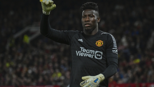 Manchester United's goalkeeper Andre Onana reacts during the English Premier League soccer match between Manchester United and Wolverhampton at the Old Trafford stadium in Manchester, England, Monday, Aug. 14, 2023. (AP Photo/Rui Vieira)