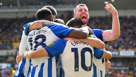 WOLVERHAMPTON, ENGLAND - AUGUST 19: Adam Webster of Brighton & Hove Albion celebrates after team mate Solly March scored the team's fourth goal during the Premier League match between Wolverhampton Wanderers and Brighton & Hove Albion at Molineux on August 19, 2023 in Wolverhampton, England. (Photo by Clive Mason/Getty Images)