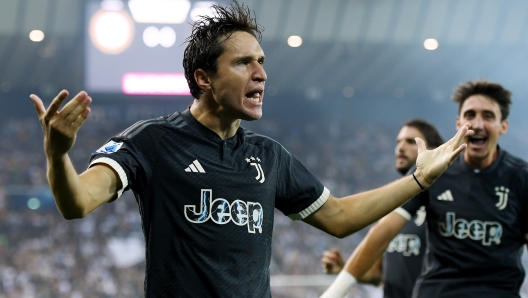 UDINE, ITALY - AUGUST 20: Federico Chiesa of Juventus celebrates after scoring the team's first goal during the Serie A TIM match between Udinese Calcio and Juventus at Dacia Arena on August 20, 2023 in Udine, Italy. (Photo by Alessandro Sabattini/Getty Images)