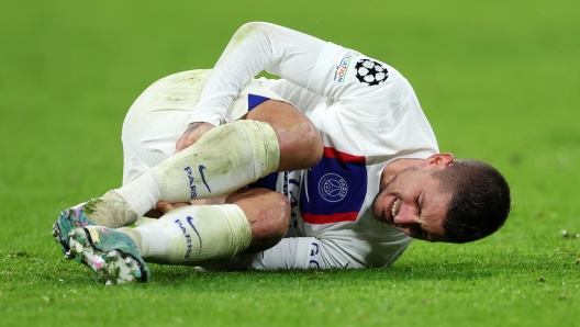 MUNICH, GERMANY - MARCH 08: Marco Verratti of Paris Saint-Germain goes down with an injury after being tackled by Joshua Kimmich of FC Bayern Munich (not pictured) during the UEFA Champions League round of 16 leg two match between FC Bayern München and Paris Saint-Germain at Allianz Arena on March 08, 2023 in Munich, Germany. (Photo by Alex Grimm/Getty Images)