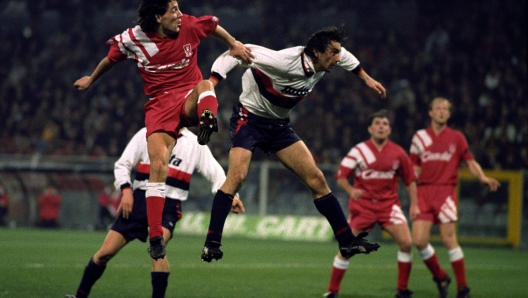 Liverpool's Dean Saunders jumps for the ball, watched by team mates Ray Houghton, second right, and Mark Wright, during the UEFA Cup Fourth Round match against Genoa.  (Photo by Neal Simpson - PA Images via Getty Images)