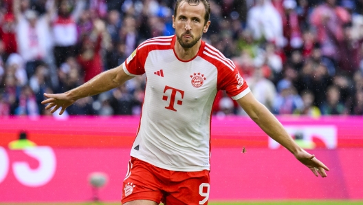 Munich's Harry Kane celebrates scoring, during the German Bundesliga soccer match between Bayern Munich and FC Augsburg, at the Allianz Arena, in Munich, Germany, Sunday, Aug. 27, 2023. (Tom Weller/dpa via AP)