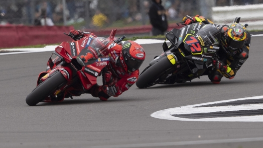 NORTHAMPTON, ENGLAND - AUGUST 06: Francesco Bagnaia of Italy and Ducati Lenovo Team leads Marco Bezzecchi of Italy and Mooney VR46 Racing Team during the MotoGP race during the MotoGP of Great Britain - Race at Silverstone Circuit on August 06, 2023 in Northampton, England. (Photo by Mirco Lazzari gp/Getty Images)