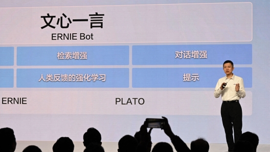 (FILES) Baidu CTO Wang Haifeng speaks at the unveiling of Baidus AI chatbot Ernie Bot at an event in Beijing on March 16, 2023. Tech giant Baidu launched China's first public artificial intelligence chatbot on August 31, with ERNIE trained to censor highly sensitive topics for the ruling Communist Party such as the Tiananmen crackdown. (Photo by MICHAEL ZHANG / AFP)