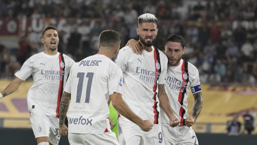 Foto Fabrizio Corradetti/LaPresse 01 Settembre 2023 Roma, Italia - AS Roma vs AC Milan - Campionato italiano di calcio Serie A TIM 2023/2024 - Stadio Olimpico. Nella foto: Olivier Giroud (AC Milan);  esulta dopo il gol 0-1  September 01, 2023 Rome, Italy - AS Roma vs AC Milan - Italian Serie A Football Championship 2023/2024 - Olympic Stadium. In the photo: Olivier Giroud (AC Milan);  celebrates after scoring the goal 0-1