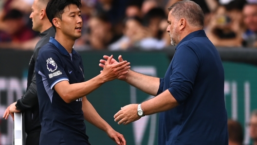 BURNLEY, ENGLAND - SEPTEMBER 02: Heung-Min Son of Tottenham Hotspur shakes hands with Ange Postecoglou, Manager of Tottenham Hotspur, as he is substituted off during the Premier League match between Burnley FC and Tottenham Hotspur at Turf Moor on September 02, 2023 in Burnley, England. (Photo by Gareth Copley/Getty Images)