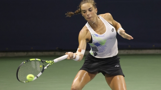 Lucia Bronzetti, of Italy, returns a shot to Barbora Krejcikova, of the Czech Republic, during the first round of the U.S. Open tennis championships, Tuesday, Aug. 29, 2023, in New York. (AP Photo/Jason DeCrow)