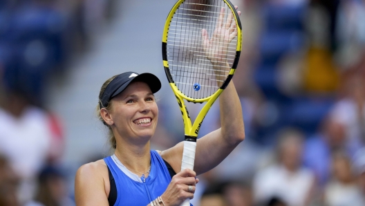 Caroline Wozniacki, of Denmark, waves to fans after defeating Jennifer Brady, of the United States, during the third round of the U.S. Open tennis championships, Friday, Sept. 1, 2023, in New York. (AP Photo/Manu Fernandez)