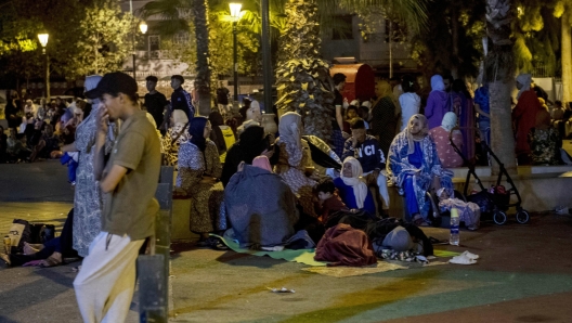 epa10849885 People seek safety outside after an earthquake in Rabat, Morocco, 08 September 2023. A 6.8-magnitude earthquake struck Morocco late 08 September, damaging buildings in major cities and sending panicked people pouring into streets and alleys. According to Morocco's state-run media, at least 296 people died in the earthquake in the provinces and prefectures of Al Haouz, Marrakech, Ouarzazate, Azilal, Chichaoua and Taroudant, and 153 people were injured.  EPA/Jalal Morchidi