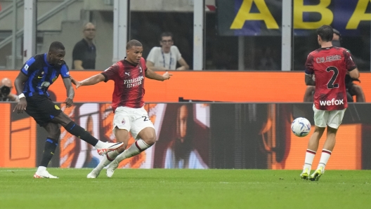 Inter Milan's Marcus Thuram, left, scores his side's 2nd goal during a Serie A soccer match between Inter Milan and AC Milan at the San Siro stadium in Milan, Italy, Saturday, Sept.16, 2023. (AP Photo/Luca Bruno)