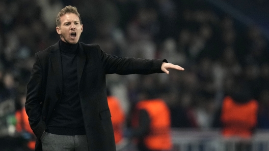 FILE - Then Bayern's head coach Julian Nagelsmann gives instructions to his players during the Champions League round of 16 first leg soccer match between Paris Saint Germain and Bayern Munich, at the Parc des Princes stadium, in Paris, France, Tuesday, Feb. 14, 2023. Germany has appointed former Bayern Munich coach Julian Nagelsmann to lead the men?s national soccer team. The German soccer federation says Nagelsmann is taking over on a short-term contract through the European Championship next summer. Germany is hosting the tournament. (AP Photo/Christophe Ena, File)