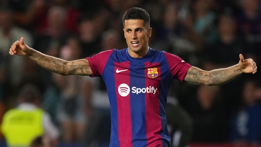 BARCELONA, SPAIN - SEPTEMBER 23: Joao Cancelo of Barcelona celebrates after scoring the team's third goal during the LaLiga EA Sports match between FC Barcelona and Celta Vigo at Estadi Olimpic Lluis Companys on September 23, 2023 in Barcelona, Spain. (Photo by Alex Caparros/Getty Images)