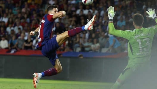 Barcelona's Robert Lewandowski scores his side's first goal during a Spanish La Liga soccer match between Barcelona and Celta at the Olympic Stadium of Montjuic in Barcelona, Spain, Saturday, Sept. 23, 2023. (AP Photo/Joan Monfort)