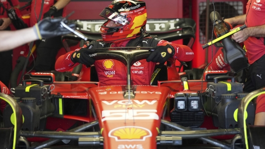 Ferrari driver Carlos Sainz of Spain exits his car after the third practice ahead of the Japanese Formula One Grand Prix at the Suzuka Circuit, Suzuka, central Japan, Saturday, Sept. 23, 2023. (AP Photo/Toru Hanai)