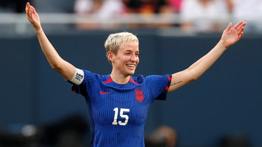 USA's forward #15 Megan Rapinoe celebrates her team's second goal scored by USA's defender #14 Emily Sonnett (out of frame) during the women's international friendly football match between the USA and South Africa at Soldier Field in Chicago on September 24, 2023. Megan Rapinoe, who championed social justice and fought for women's equal pay in a 17-year international career, will play her final match for the United States on September 24, 2023 against South Africa. (Photo by KAMIL KRZACZYNSKI / AFP)