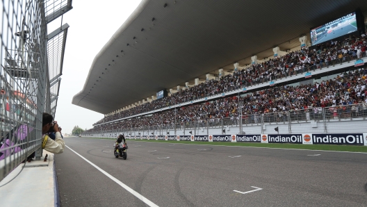 epa10880314 Italian rider Marco Bezzecchi of Mooney VR46 Racing Team reacts after winning the MotoGP race of the inaugural Motorcycling Grand Prix of India, in Dankaur, near Greater Noida, India, 24 September 2023.  EPA/HARISH TYAGI