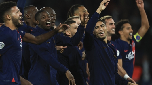 PSG players celebrate their victory after the French League One soccer match between Paris Saint Germain and Olympique de Marseille at Parc des Princes stadium in Paris, France, Sunday, Sept. 24, 2023. (AP Photo/Aurelien Morissard)