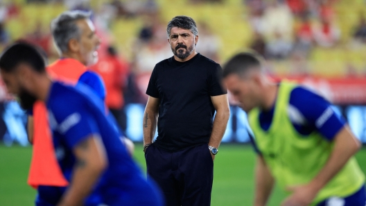 Marseille's Italian head coach Gennaro Gattuso looks at his players as they warm up prior to the start of the French L1 football match between AS Monaco and Olympique Marseille (OM) at the Louis II Stadium (Stade Louis II) in the Principality of Monaco on September 30, 2023. (Photo by Valery HACHE / AFP)