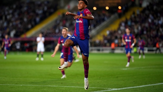 BARCELONA, SPAIN - SEPTEMBER 29: Lamine Yamal of Barcelona celebrates as Sergio Ramos of Sevilla (not pictured) scores an own-goal during the LaLiga EA Sports match between FC Barcelona and Sevilla FC at Estadi Olimpic Lluis Companys on September 29, 2023 in Barcelona, Spain. (Photo by Alex Caparros/Getty Images)