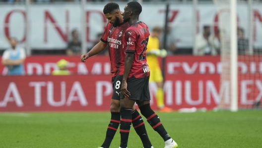 AC Milan's Ruben Loftus-Cheek, left, flanked by AC Milan's Fikayo Tomori, walks off the pitch during a Serie A soccer match between AC Milan and Lazio, at the San Siro stadium in Milan, Italy, Saturday, Sept. 30, 2023. (AP Photo/Luca Bruno)