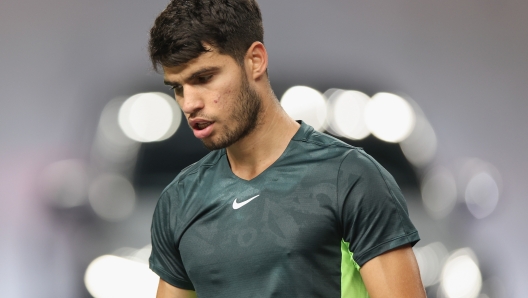 SHANGHAI, CHINA - OCTOBER 09:  Carlos Alcaraz of Spain reacts in the Men's Singles Round of 32 match against Dan Evans of Great Britain on Day 8 of the 2023 Shanghai Rolex Masters at Qi Zhong Tennis Centre on October 9, 2023 in Shanghai, China. (Photo by Lintao Zhang/Getty Images)