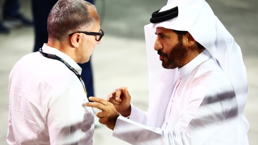 LUSAIL CITY, QATAR - OCTOBER 07: Stefano Domenicali, CEO of the Formula One Group, talks with Mohammed ben Sulayem, FIA President, in parc ferme during the Sprint ahead of the F1 Grand Prix of Qatar at Lusail International Circuit on October 07, 2023 in Lusail City, Qatar. (Photo by Clive Rose/Getty Images)