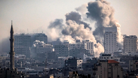 Smoke plumes billow during Israeli air strikes in Gaza City on October 12, 2023 as raging battles between Israel and the Hamas movement continue for the sixth consecutive day. Washington urged Israel to show restraint in its response to Hamas's surprise attack -- the worst in the country's 75-year history -- which Israeli forces said killed more than 1,200 people, mostly civilians. In Gaza, officials have reported more than 1,200 people killed in Israel's uninterrupted campaign of air and artillery strikes, while the UN said more than 338,000 people have been displaced. (Photo by Mahmud HAMS / AFP)